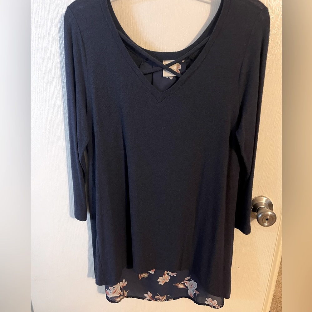 Blue top with floral pattern on back